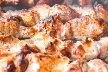 Skewers of pork. Fried pork meat cooked over burning coals.