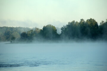 Plakat Fog on the river early in the morning during the summer