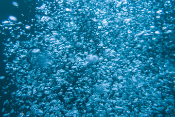Blurred background image of air bubbles under water