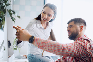 Young business people working together on project in modern office