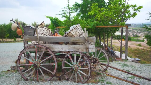 4K stock video footage of beautiful old vintage farm wooden wagon with wooden wheels used as street decor in Turkey. Goreme, Cappadocia
