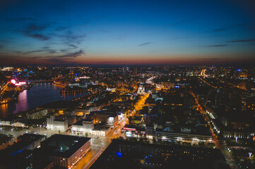 Obraz premium Aerial view of the night modern Yekaterinburg city. Bright lights of the night streets. 