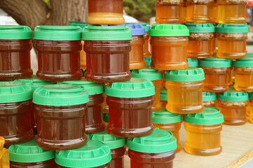 Stacks of Jars of Natural Honey in a Local Stall of Georgia's Countryside