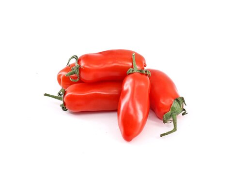Small San Marzano tomatoes, an italian variety of plum tomato,   on white background. They are considered the only ones  that can be used for true Neapolitan pizza.
