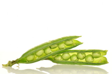 Two ripe organic, green pea pods, close-up, isolated on white.