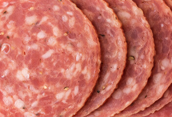 Close view of several slices of dry salami