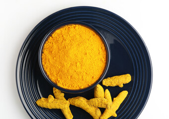 Turmeric roots with turmeric powder
