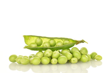Several ripe green peas, close-up, isolated on white.
