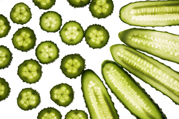 Cucumber green slices pattern isolated on white background. Creative cucumbers wallpaper, food backdrop design