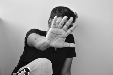 stop hand of teenager, sign of discrimination or anti violence symbol. Stop abusing violence. - obrazy, fototapety, plakaty