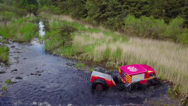 Sherp rescue is a Ukrainian all-terrain amphibious vehicles for rough and soggy terrain. Sherp drives through the swamp. Aerial drone view.