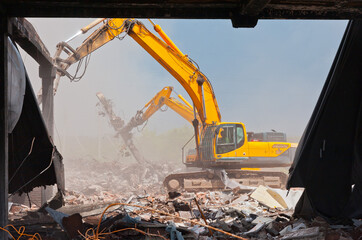 Demolators at the demolition site of the old building.