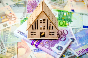 The symbol of the house stands on the background of the Euro