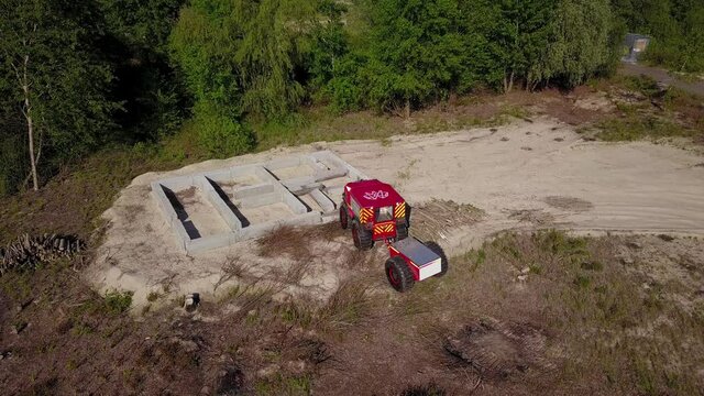 Sherp rescue is a Ukrainian all-terrain amphibious vehicles for rough and soggy terrain. Sherp drives through concrete blocks. Aerial drone view.