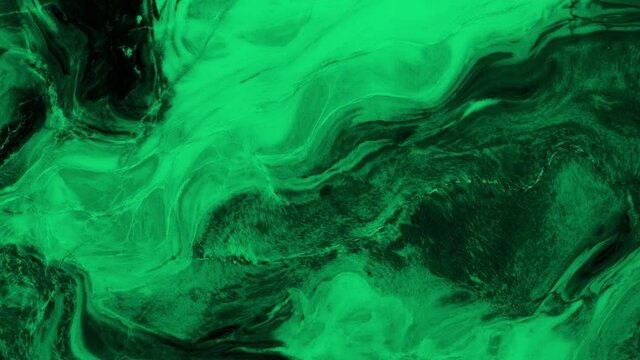 Animation of vibrant coloured green liquid flowing in hypnotic motion on black background