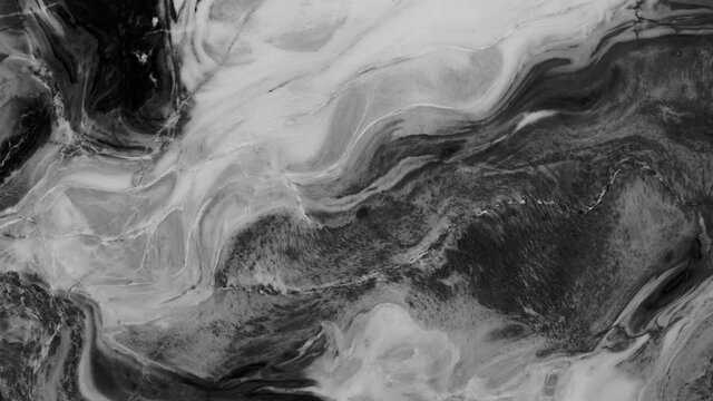Animation of vibrant coloured grey liquid flowing in hypnotic motion on black background