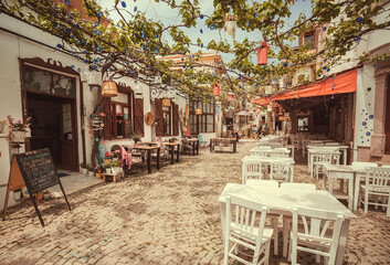 Sunny cafe with terrace with tables and without people on touristic area of  Turkey