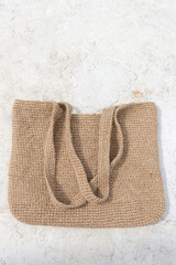 A bag made of jute. Handmade, crocheted. Eco-friendly shopping bag for going to the grocery store.