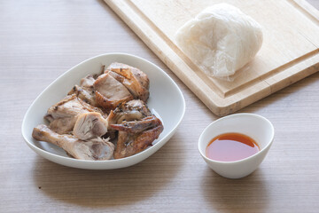 Thai style grilled herb chicken eat with hot and chili sweet dip