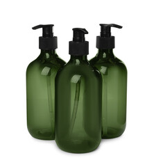 Reusable green plastic dispensers on white background