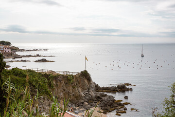 breakwater, sea, beach and rocks in Palafrugell