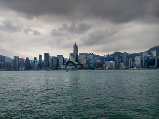 View of the skyline of Hong Kong island. Skyscrapers and cloudy weather. Victoria Harbour 