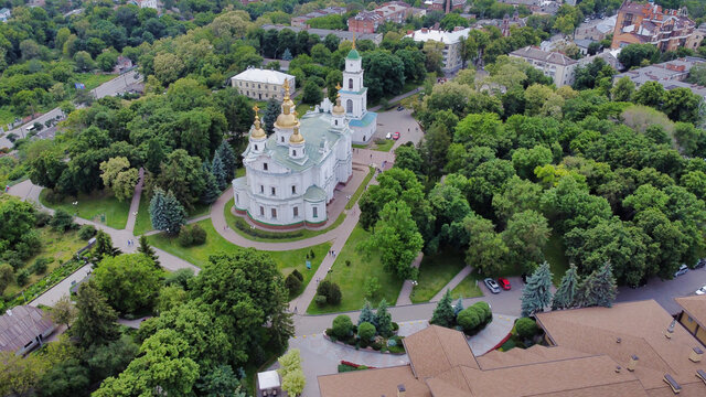 Poltava: Assumption cathedral. Houses in Historic center and green trees. Ukraine. Europe
