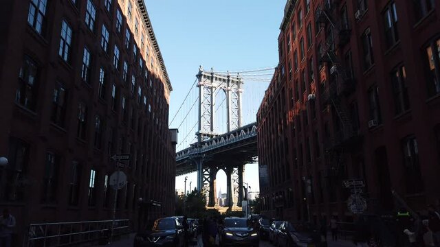 View on Manhattan Bridge from DUMBO with blue sky - camera move from left to right