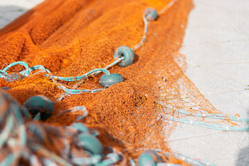 Fishing net bright orange color with float line