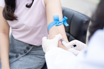 The doctor is using a syringe to give the patient a syringe.