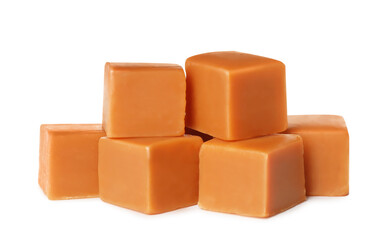 Many caramel cubes on white background. Confectionery