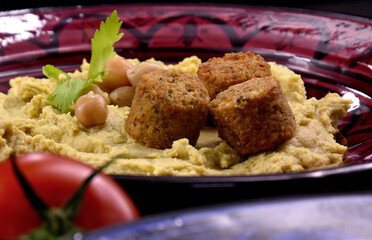 Falafel with chickpea hummus food close-up stock images. Traditional homemade hummus with falafel detail stock photo. Delicious Middle Eastern cuisine images