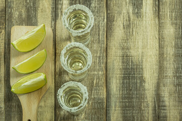 The glasses are filled with tequila and lime and salt