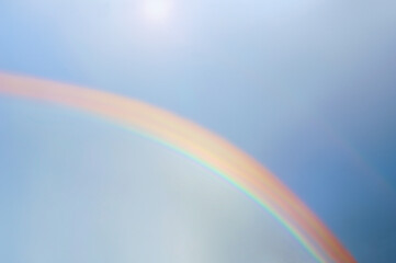 Fototapeta premium Big rainbow in a blue sky at sunset. Afterglow.