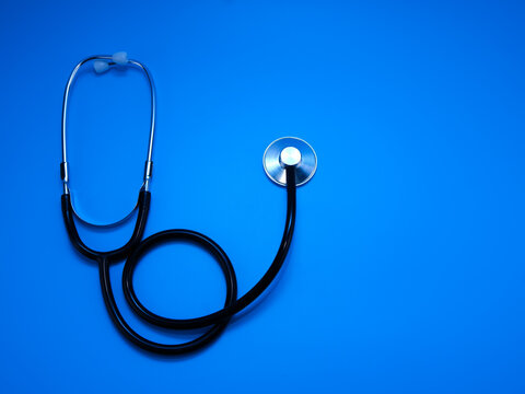An image of a stethoscope isolated on a blue background.