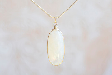 Mineral moon stone sterling silver simple pendant on neutral background