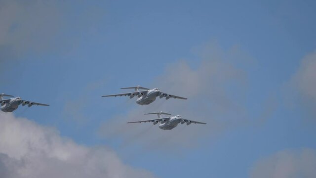 Avia parade in Moscow. 3 Ilyushin Il-76 multi-purpose four-engined strategic airlifters fly in the sky on parade of Victory in World War II in Moscow, Russia