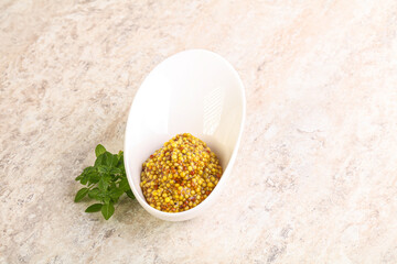 Grain mustard sauce in the bowl