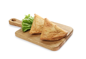 Fresh delicious crispy samosas and lettuce on white background