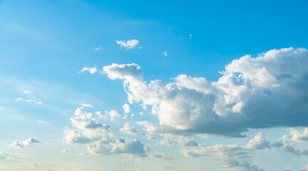 Blue sky with beautiful natural white clouds. Space for text. Background.