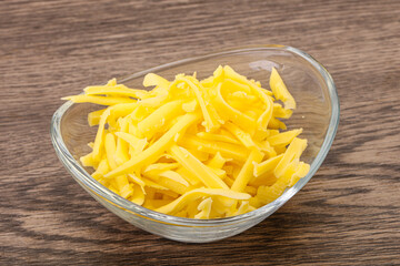 Shredded yellow cheese in the bowl