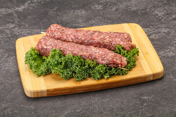 Raw minced beef kebab skewer