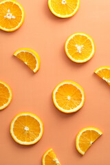 Orange slices on color background. Citrus fruits pattern. Flat lay, top view