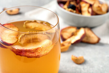 Delicious compote with dried apple slices in glass, closeup. Space for text