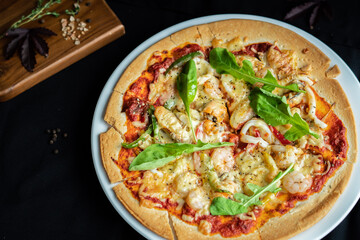 Seafood Pizza ,hand pick pizza, eating pizza and having fun. leisure, food and drinks, people and holidays concept