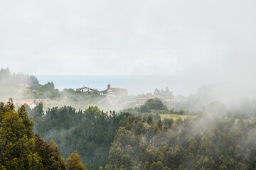 A small town on top of the mountain full of mist. Spring in Ispaster next to Lekeitio, landscapes...