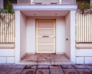 contemporary house front entrance, white door by the sidewalk
