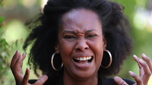 Angry woman screaming upset in frustration