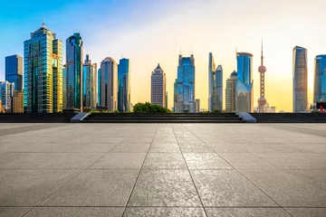 Schilderijen op glas Sunset empty square road and city skyline in Shanghai © zhao dongfang