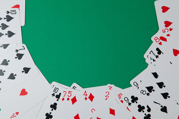 Classic playing cards on green background. Gambling and casino concept. - obrazy, fototapety, plakaty